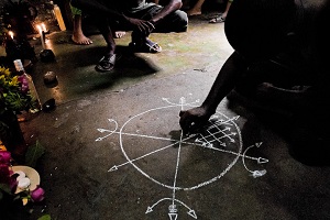 Spellcaster drawing a magic circle during a ritual